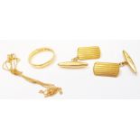 A pair of British hallmarked 18ct. gold cuff-links - sold with a damaged 22ct. gold wedding band and