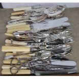 A quantity of assorted silver plated cutlery including Walker & Hall examples etc.