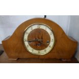 A mid 20th Century polished walnut cased Bentima mantel clock with floating escapement and eight day