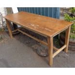 A polished pine farmhouse kitchen table set on chamfered square legs - length 6' 2"