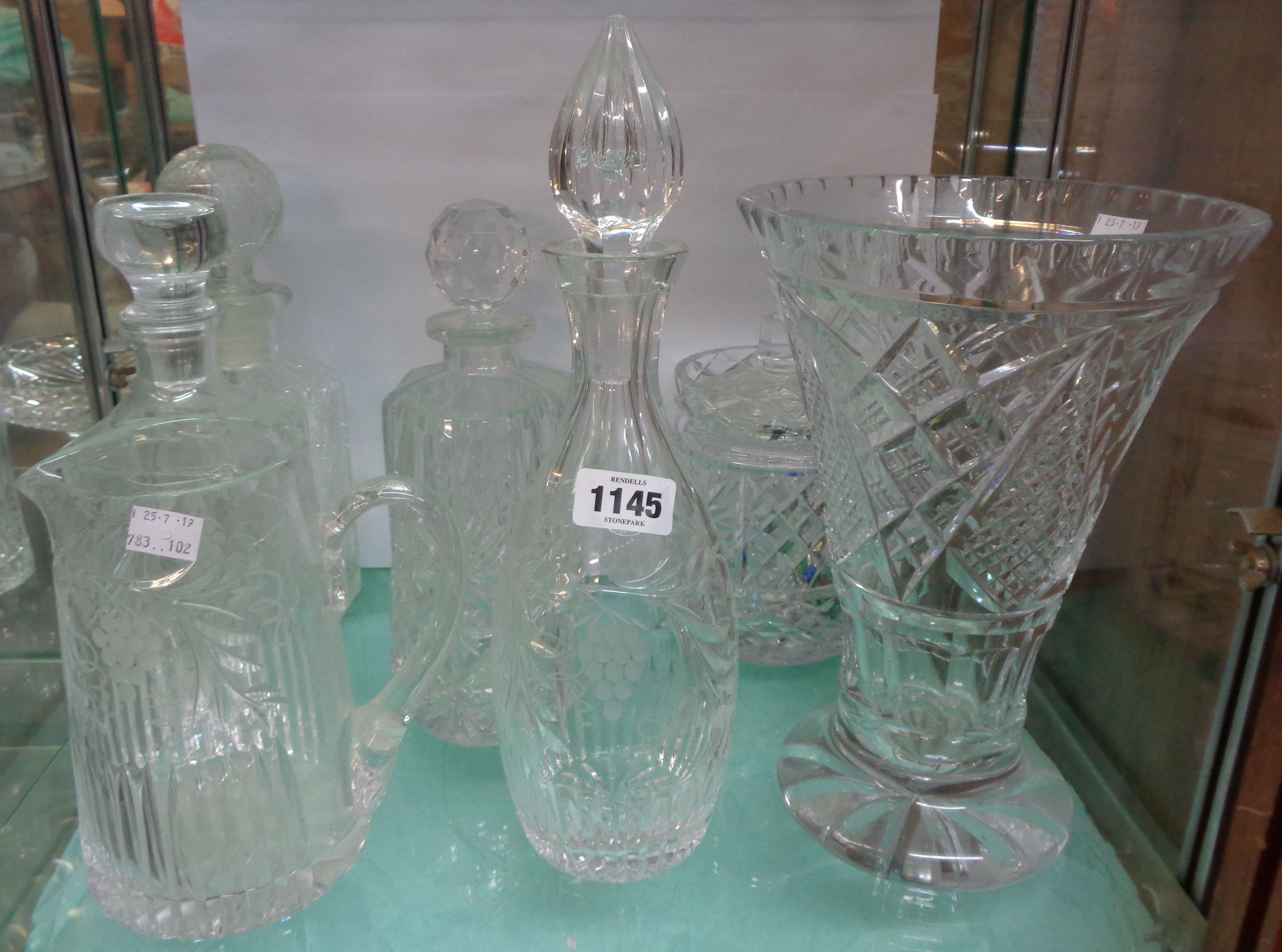 A collection of cut glass vases, decanters, etc.