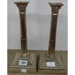 A pair of 12" silver plated column candlestick/table lamps with detachable nozzles and loaded