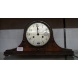 An early 20th Century polished oak Napoleon hat mantel clock with eight day gong striking movement