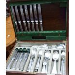 An Elkington & Co. oak canteen containing a part set of associated silver plated cutlery