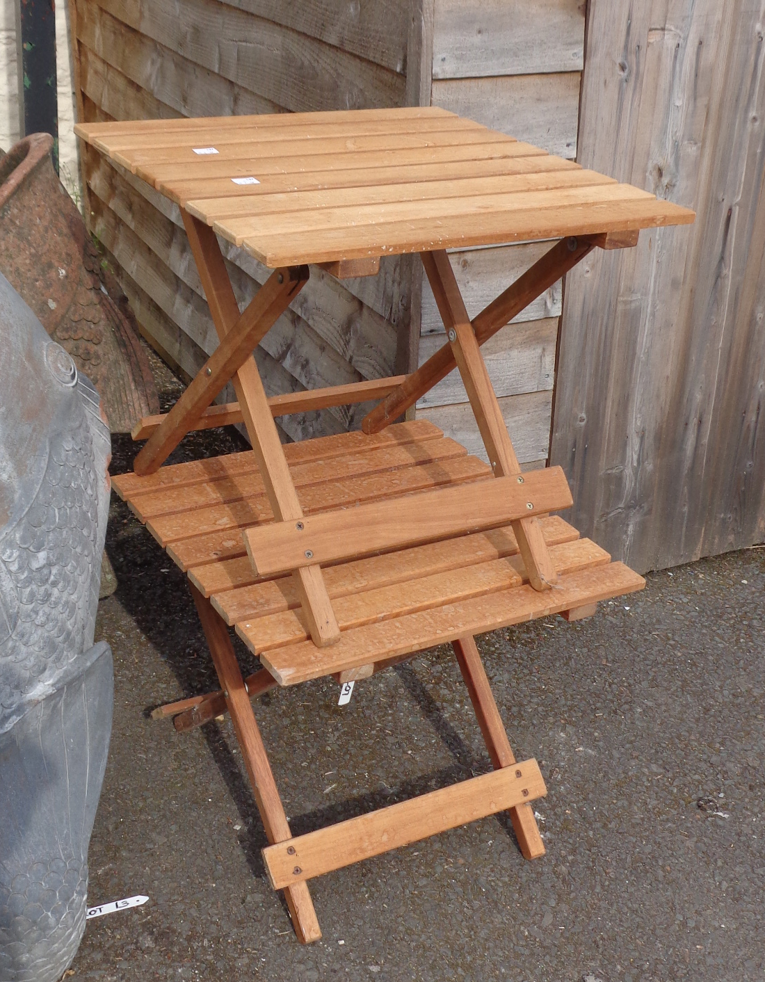 Two small folding tables with slatted tops