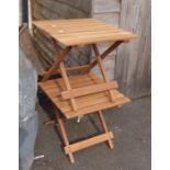 Two small folding tables with slatted tops