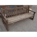 A slatted wood garden bench - length 5' 10"