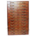 A 28" early 20th Century commercial oak filing chest with flight of twelve fall-front drawers and