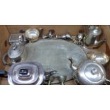 A box containing a quantity of silver plated items including teaware, egg cups and oval tray, etc.