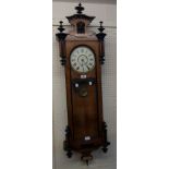 An early 20th Century walnut and part ebonised cased regulator style wall clock with visible