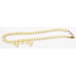 A cultured pearl necklace with 9ct. gold clasp, other loose pearls included