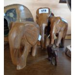 Four carved wood elephants
