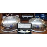 A pair of silver plated meat domes with detachable handles and engraved decoration - one 15 3/4" and