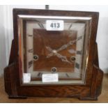 A mid 20th Century polished oak cased mantel clock with eight day Westminster chiming movement