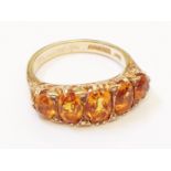 A British hallmarked 375 gold five stone citrine ring