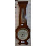 An early 20th Century ebony lined walnut cased Short & Mason aneroid barometer/thermometer