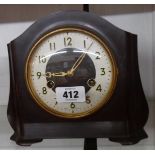 A vintage Smiths brown Bakelite cased mantel clock with eight day gong striking movement