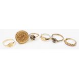 An import marked 375 gold sovereign style signet ring - sold with five other mixed metal rings -