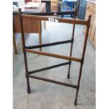 An Edwardian mahogany folding clothes horse with slender turned supports