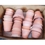 A box containing a quantity of assorted terracotta flower pots