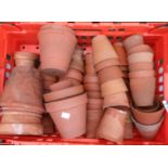 A box containing a quantity of assorted terracotta flower pots