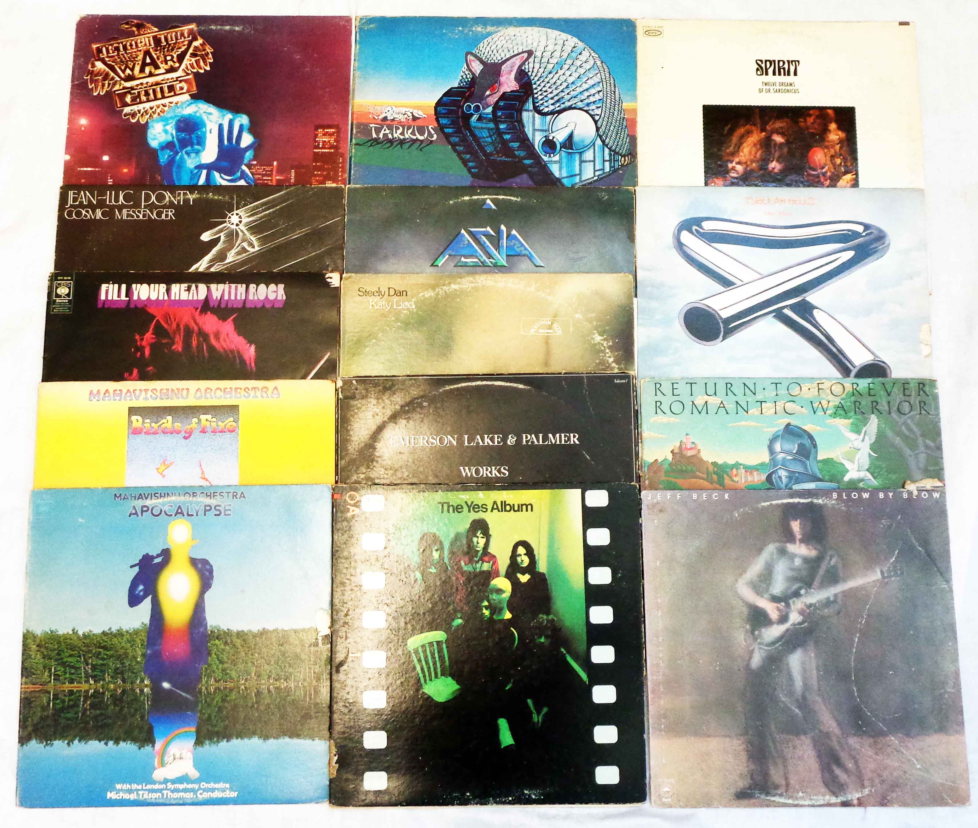 A small collection of vinyl LPs including Emerson, Lake & Palmer "Tarkus", Mike Oldfield, Spirit,