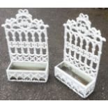 A pair of cast-iron wall hanging garden troughs