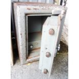 A vintage CWS safe with key - 19" X 25 1/2"