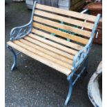 A small cast-iron bench with slatted wood seat - length 31"