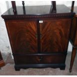 A 32" reproduction mahogany and strung TV cabinet with fall-front compartment under