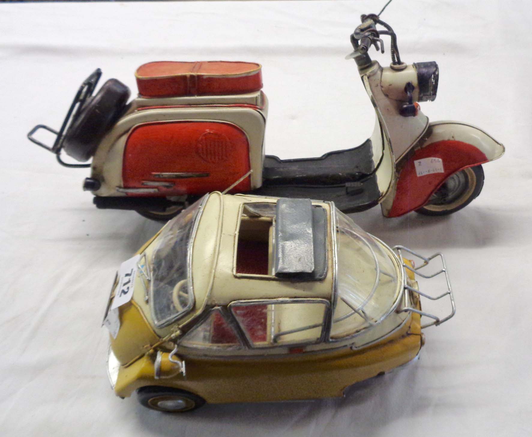 A modern painted tinplate model bubble car and similar scooter