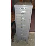 An 11 1/2" vintage grey painted metal twelve drawer filing cabinet