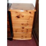 A 17 1/4" modern waxed pine bedside chest of four drawers