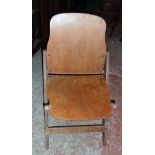 A Second World War period US Army folding chair with moulded plywood back and seat panels