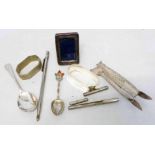 A bag containing silver and white metal items including fish tail pattern tongs, etc.