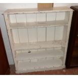 A 3' 5 1/4" Victorian later painted pine four shelf open bookcase, set on plinth base