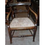 A 19th Century stained beech framed late Regency design elbow chair with upholstered seat panel