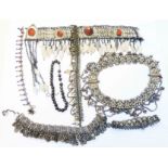 A collection of Persian white metal bracelets and necklaces, some set with coloured and hardstones