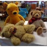 A Harrods Christmas bear, large Winnie The Pooh and a Metro bear