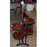 An early 20th Century mahogany and strung four tier folding cake stand