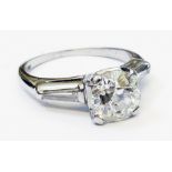 A Platinum-Iridium diamond solitaire ring - approx 2ct., with baguette diamonds to shoulders