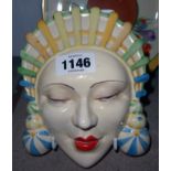 A Clarice Cliff mask Marlene in pastel yellow/green colourway