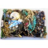 A bag containing a collection of mainly costume jewellery necklaces, etc.