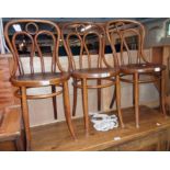 Three antique Eastern European bentwood chairs with decorative backs and machine pressed circular