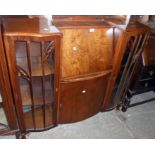 A 4' mid 20th Century polished walnut side-by-side cabinet with central fall and cupboard flanked by