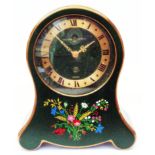 A mid 20th Century Swiss Reuge St. Croix musical alarm clock in green finish with floral spray