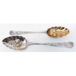 Two Georgian silver spoons with later berry decoration, one with parcel gilt bowl
