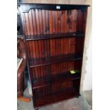 A 32" modern stained pine four shelf open bookcase