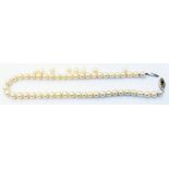 A cultured pearl necklace with 9ct. gold clasp, other loose pearls included
