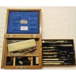 A late Victorian oak cased harlequin set of technical drawing instruments, some with ivory handles